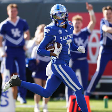 Dec 29, 2023; Jacksonville, FL, USA;  Kentucky Wildcats wide receiver Barion Brown (7) runs into the end zone for  touchdown against the Clemson tigers in the fourth quarter during the Gator Bowl at EverBank Stadium. Mandatory Credit: Nathan Ray Seebeck-Imagn Images