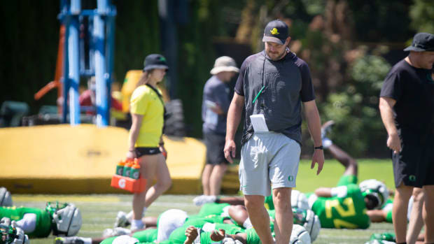 Oregon head coach Dan Lanning walks the field during the Ducks’ fall camp Tuesday, Aug. 6, 2024, at the Hatfield-Dowlin Compl