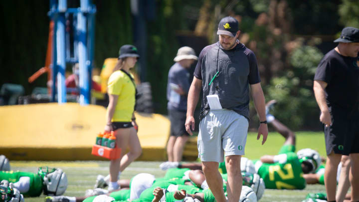 Oregon head coach Dan Lanning walks the field during the Ducks’ fall camp Tuesday, Aug. 6, 2024, at the Hatfield-Dowlin Complex in Eugene, Ore.