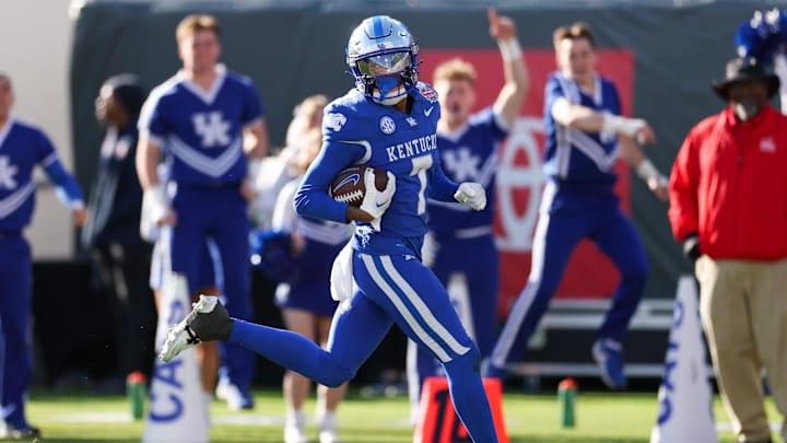 Dec 29, 2023; Jacksonville, FL, USA;  Kentucky Wildcats wide receiver Barion Brown (7) runs into the end zone for  touchdown against the Clemson tigers in the fourth quarter during the Gator Bowl at EverBank Stadium. Mandatory Credit: Nathan Ray Seebeck-Imagn Images