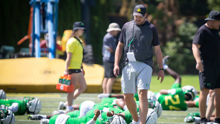 Oregon head coach Dan Lanning walks the field during the Ducks’ fall camp Tuesday, Aug. 6, 2024, at the Hatfield-Dowlin Complex in Eugene, Ore.