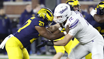 Nov 23, 2024; Ann Arbor, Michigan, USA;  Northwestern Wildcats offensive lineman Caleb Tiernan (72) blocks Michigan Wolverines defensive end Tyler McLaurin (27) in the second half at Michigan Stadium. Mandatory Credit: Rick Osentoski-Imagn Images