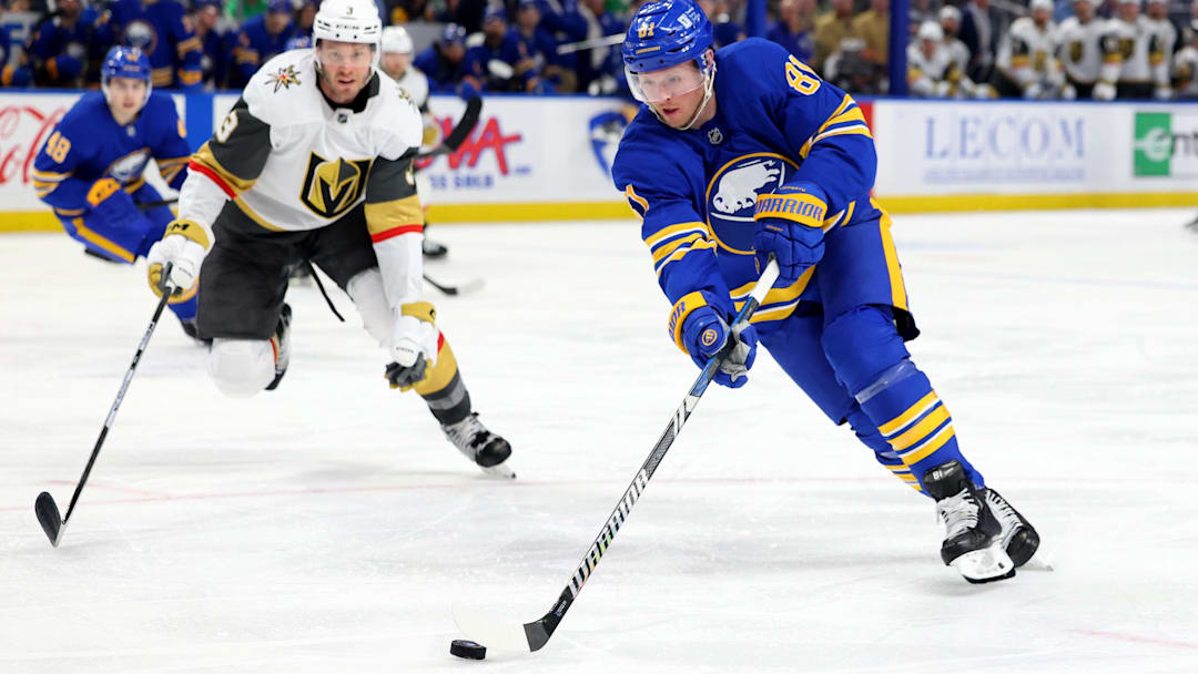 Mar 15, 2025; Buffalo, New York, USA;  Buffalo Sabres center Sam Lafferty (81) looks to control the puck during the second period against the Vegas Golden Knights at KeyBank Center. Mandatory Credit: Timothy T. Ludwig-Imagn Images