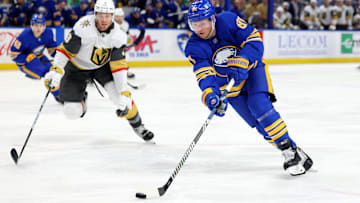 Mar 15, 2025; Buffalo, New York, USA;  Buffalo Sabres center Sam Lafferty (81) looks to control the puck during the second period against the Vegas Golden Knights at KeyBank Center. Mandatory Credit: Timothy T. Ludwig-Imagn Images