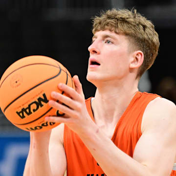 Mar 20, 2025; Milwaukee, WI, USA; Illinois Fighting Illini guard Kasparas Jakucionis (32) shoots the ball during NCAA Tournament First Round Practice at Fiserv Forum. Mandatory Credit: Benny Sieu-Imagn Images
