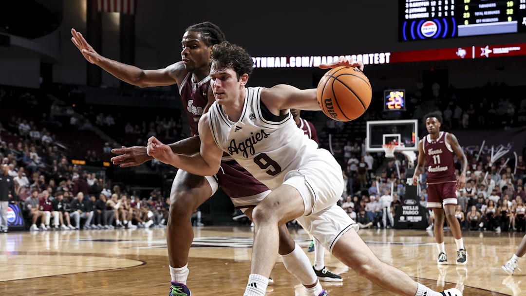 Texas A&M Aggies guard Ruben Dominguez drives against Texas Southern Tigers forward Troy Hupstead during the second half at Reed Arena. 