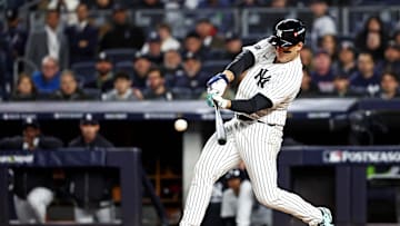 Oct 14, 2024; Bronx, New York, USA; New York Yankees first base Anthony Rizzo (48) hits a single during the second inning against the Cleveland Guardians in game one of the ALCS for the 2024 MLB Playoffs at Yankee Stadium. Mandatory Credit: Wendell Cruz-Imagn Images