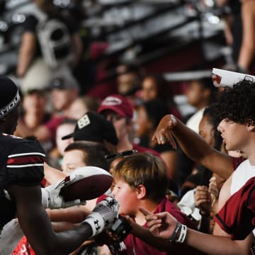 The University of South Carolina Spring football game took place at William-Brice Stadium on April 24, 2024. USC's Mazeo Bennett (3) from Greenville High greets fans on the sidelines.