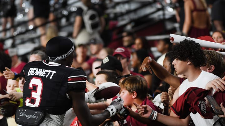 South Carolina football true freshman Mazeo Bennett signing autographs after the Garnet and Black Spring Game this April