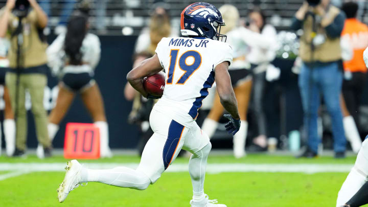 Jan 7, 2024; Paradise, Nevada, USA; Denver Broncos wide receiver Marvin Mims Jr. (19) returns a kick against the Las Vegas Raiders during the first quarter at Allegiant Stadium. Mandatory Credit: Stephen R. Sylvanie-USA TODAY Sports