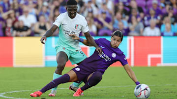 Nov 17, 2024; Orlando, FL, USA; Orlando Pride defender Emily Sams (6) and Kansas City Current forward Nichelle Prince (8) battle for the ball in a NWSL playoff semifinal match at Inter&Co Stadium. Mandatory Credit: Mike Watters-Imagn Images