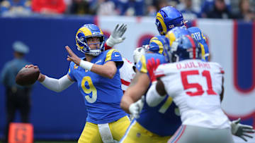 Oct 17, 2021; East Rutherford, New Jersey, USA; Los Angeles Rams quarterback Matthew Stafford (9) throws a pass against the New York Giants during the first quarter at MetLife Stadium. Mandatory Credit: Brad Penner-Imagn Images