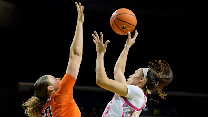 Oregon guard Katie Fiso goes up for a shot over Illinois forward Cearah Parchment as the Oregon Ducks host the Illinois Fighting Illini on Feb. 4, 2026, at Matthew Knight Arena in Eugene, Oregon.