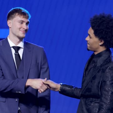 Jun 25, 2025; Brooklyn, NY, USA; Cooper Flagg and Dylan Harper shake hands on stage before the 2025 NBA Draft at Barclays Center. Mandatory Credit: Brad Penner-Imagn Images