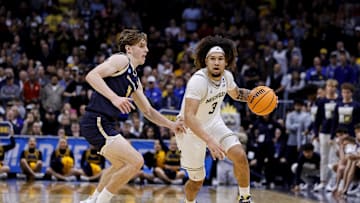 March 20, 2025; Denver, CO, USA; Michigan Wolverines guard Tre Donaldson (3) dribbles the ball during the second half as UC San Diego Tritons guard Hayden Gray (3) defends at Ball Arena. Mandatory Credit: Isaiah J. Downing-Imagn Images