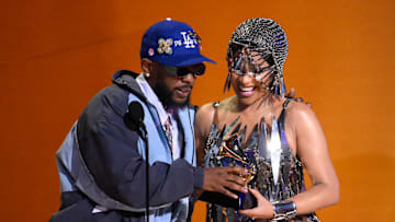 Cardi B presents Kendrick Lamar with an award for best rap album for ÒMr. Morale & The Big SteppersÓ during the Grammy Awards