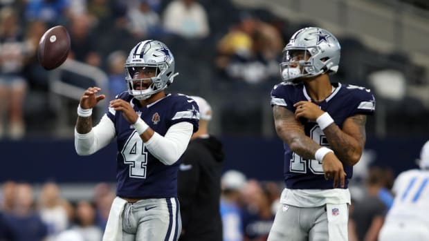 Dallas Cowboys quarterback Dak Prescott (4) and  quarterback Trey Lance (19) warm up before the game against the Los Angeles 