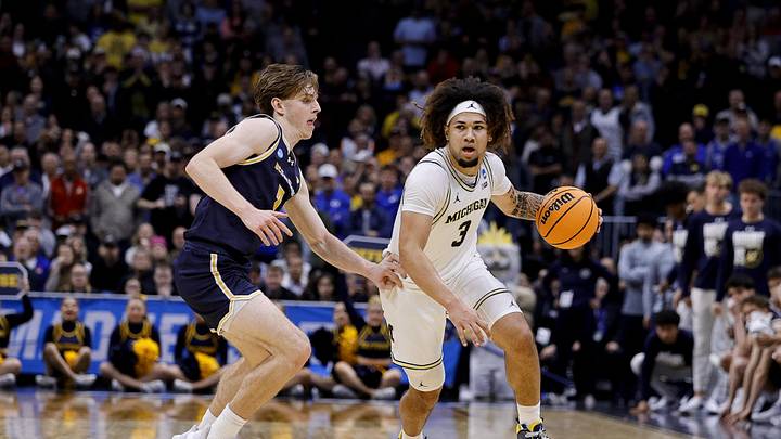 March 20, 2025; Denver, CO, USA; Michigan Wolverines guard Tre Donaldson (3) dribbles the ball during the second half as UC San Diego Tritons guard Hayden Gray (3) defends at Ball Arena. Mandatory Credit: Isaiah J. Downing-Imagn Images