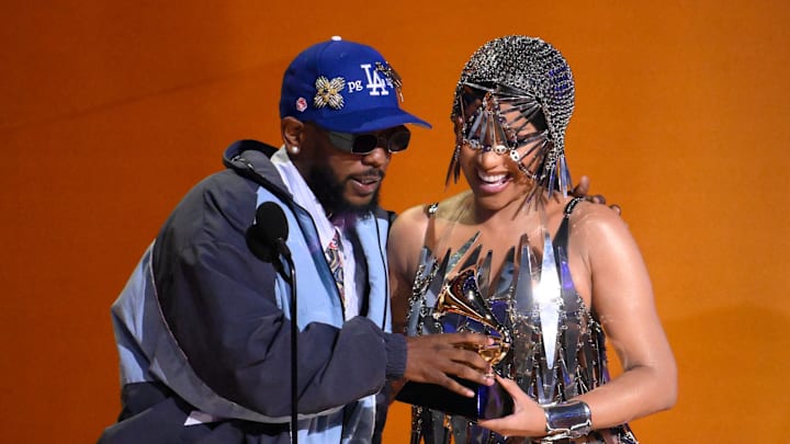 Cardi B presents Kendrick Lamar with an award for best rap album for ÒMr. Morale & The Big SteppersÓ during the Grammy Awards Cardi B presents Kendrick Lamar with an award for best rap album for ÒMr. Morale & The Big SteppersÓ during the Grammy Awards