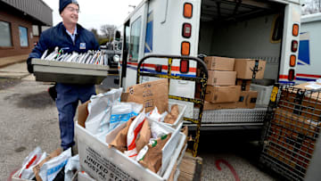 Letter Carrier Steve Homa loads up his mail truck