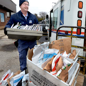 Letter Carrier Steve Homa loads up his mail truck