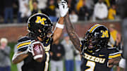 Nov 15, 2025; Columbia, Missouri, USA; Missouri Tigers corner back Toriano Pride Jr. (2) celebrates with safety Marvin Burks (1) during a matchup agai