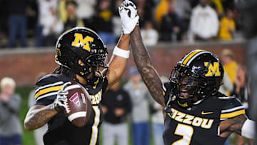 Nov 15, 2025; Columbia, Missouri, USA; Missouri Tigers corner back Toriano Pride Jr. (2) celebrates with safety Marvin Burks (1) during a matchup agai