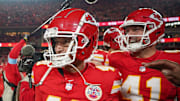 Dec 8, 2024; Kansas City, Missouri, USA; Kansas City Chiefs place kicker Matthew Wright (49) celebrates with long snapper James Winchester (41) after the win over the Los Angeles Chargers at GEHA Field at Arrowhead Stadium. Mandatory Credit: Denny Medley-Imagn Images
