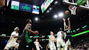 May 1, 2022; Boston, Massachusetts, USA; Boston Celtics guard Marcus Smart (36) drives to the basket against Milwaukee Bucks guard Jrue Holiday (21) in the first quarter during game one of the second round for the 2022 NBA playoffs at TD Garden. Mandatory Credit: David Butler II-Imagn Images