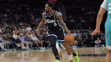 Apr 4, 2025; Charlotte, North Carolina, USA; Sacramento Kings guard Malik Monk (0) drives to the basket against the Charlotte Hornets during the second quarter at Spectrum Center. Mandatory Credit: Jim Dedmon-Imagn Images