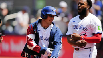 Jul 28, 2024; Toronto, Ontario, CAN; Toronto Blue Jays left fielder Daulton Varsho (25) wears the home run jacket after his two run home run against the Texas Rangers  during the first inning at Rogers Centre.