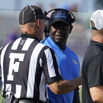 Sep 27, 2025; Evanston, Illinois, USA; UCLA Bruins interim head coach Tim Skipper talks to a official during the first half against the Northwestern Wildcats during the first half at Northwestern Medicine Field at Martin Stadium. Mandatory Credit: David Banks-Imagn Images