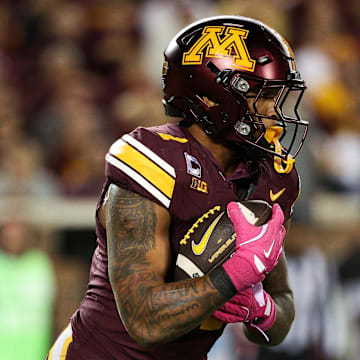 Oct 17, 2025; Minneapolis, Minnesota, USA; Minnesota Golden Gophers running back Darius Taylor (1) runs the ball against the Nebraska Cornhuskers during the second half at Huntington Bank Stadium. Mandatory Credit: Matt Krohn-Imagn Images