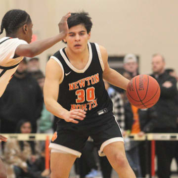 Newton North's Jose Padilla dribbles under pressure from North's Amir Jenkins during an MIAA Division I Final Four game.

Jose Padilla Amir Jenkins