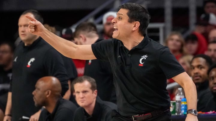 Cincinnati Bearcats head coach Wes Miller shouts to his defense in the first half of the NCAA Big 12 basketball game between the Cincinnati Bearcats and the Texas Longhorns at Fifth Third Arena in Cincinnati on Tuesday, Jan. 9, 2024.