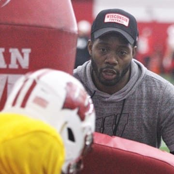 Wisconsin Badgers quarterbacks coach Kenny Guiton works with a player during a drill during practice at the McClain Center in Madison, Wisconsin.