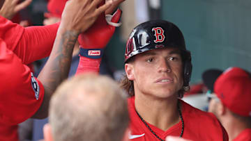 Mar 4, 2025; Bradenton, Florida, USA;  Boston Red Sox right fiedler Nate Eaton (40) is congratulated after he hit a grand slam during the fifth inning against the Pittsburgh Pirates at LECOM Park. Mandatory Credit: Kim Klement Neitzel-Imagn Images