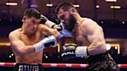 Dmitry Bivol (left) prevailed in his rematch with Artur Beterbiev last weekend.