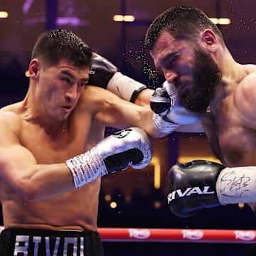 Dmitry Bivol (left) prevailed in his rematch with Artur Beterbiev last weekend.