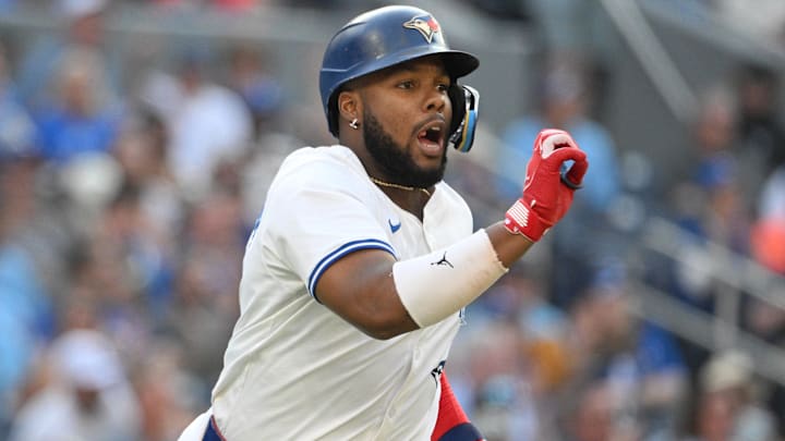 Sep 14, 2024; Toronto, Ontario, CAN;  Toronto Blue Jays first baseman Vladimir Guerrero Jr. (27) gestures to an umpire that he wants the ball after hitting his career 500th RBI against the St. Louis Cardinals in the seventh inning at Rogers Centre. 