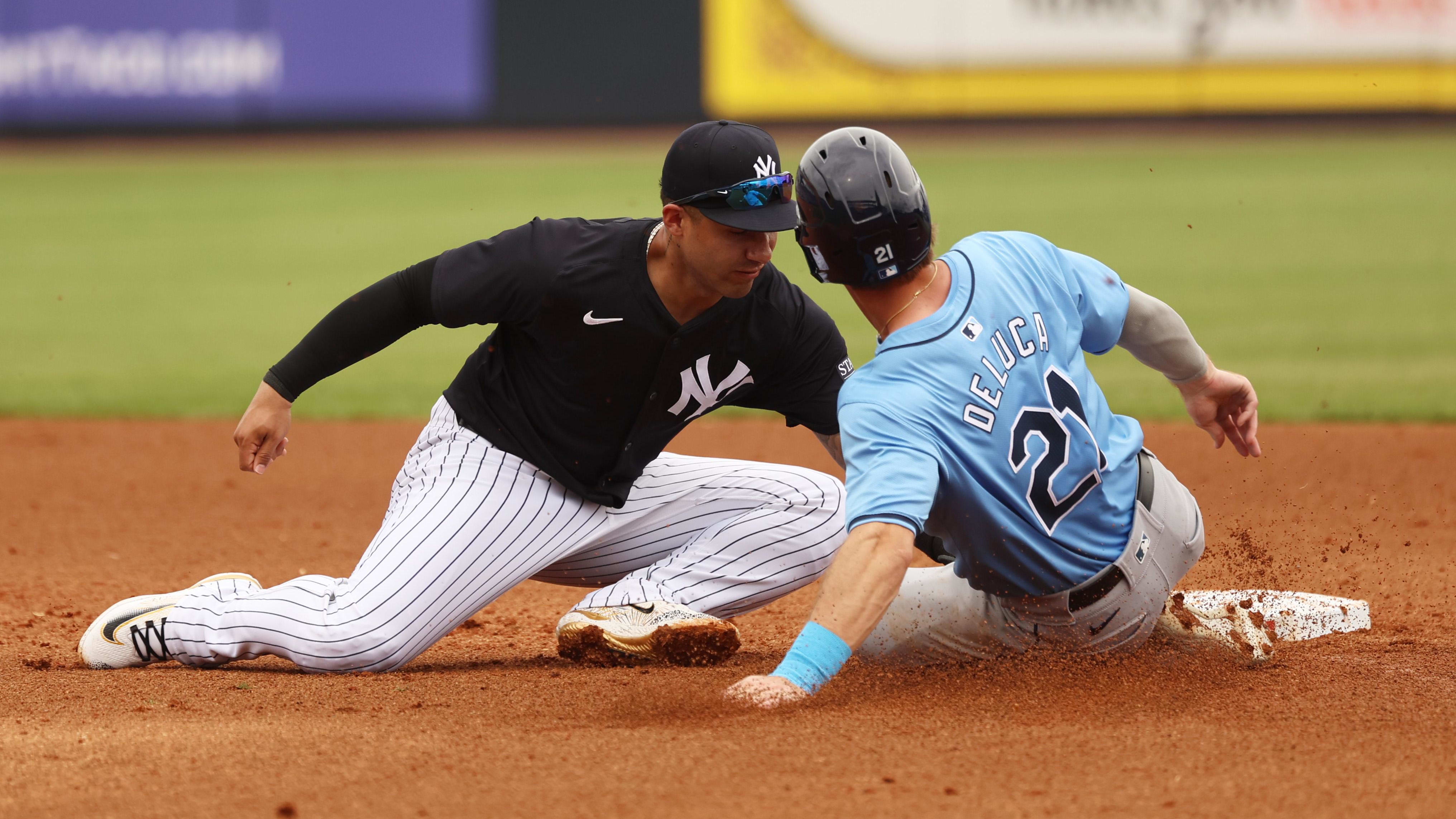 Mar 6, 2024; Tampa, Florida, USA;  Tampa Bay Rays outfielder Jonny DeLuca (21) slides into second base.