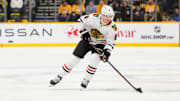Jan 16, 2025; Nashville, Tennessee, USA;  Chicago Blackhawks center Ryan Donato (8) skates with the puck against the Nashville Predators during the second period at Bridgestone Arena. Mandatory Credit: Steve Roberts-Imagn Images