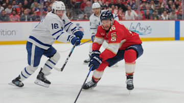 May 16, 2025; Sunrise, Florida, USA; Florida Panthers center Aleksander Barkov (16) moves the puck against Toronto Maple Leafs right wing Mitch Marner (16) during the second period in game six of the second round of the 2025 Stanley Cup Playoffs at Amerant Bank Arena. Mandatory Credit: Sam Navarro-Imagn Images
