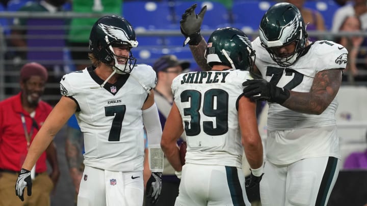 Aug 9, 2024; Baltimore, Maryland, USA; Philadelphia Eagles running back Will Shipley (39) celebrates his first quarter touchdown with quarterback Kenny Pickett (7) and tackle Darian Kinnard (72) against the Baltimore Ravens at M&T Bank Stadium.