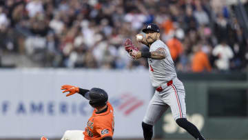 Jul 12, 2024; San Francisco, California, USA; Minnesota Twins shortstop Carlos Correa (4) throws to first base after tagging San Francisco Giants third baseman Matt Chapman (26) for a double play during the fourth inning at Oracle Park. 