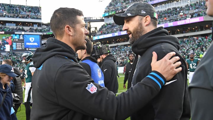Dec 8, 2024; Philadelphia, Pennsylvania, USA; Carolina Panthers head coach Dave Canales and Philadelphia Eagles head c coach Nick SIriani meet on the field after game at Lincoln Financial Field. Mandatory Credit: Eric Hartline-Imagn Images