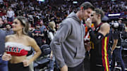 Dec 22, 2023; Miami, Florida, USA; Atlanta Hawks guard Trae Young (11) talks to Real Madrid goalkeeper Thibaut Courtois after the game against the Miami Heat at Kaseya Center. Mandatory Credit: Sam Navarro-Imagn Images
