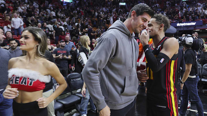 Dec 22, 2023; Miami, Florida, USA; Atlanta Hawks guard Trae Young (11) talks to Real Madrid goalkeeper Thibaut Courtois after the game against the Miami Heat at Kaseya Center. Mandatory Credit: Sam Navarro-Imagn Images Dec 22, 2023; Miami, Florida, USA; Atlanta Hawks guard Trae Young (11) talks to Real Madrid goalkeeper Thibaut Courtois after the game against the Miami Heat at Kaseya Center. Mandatory Credit: Sam Navarro-Imagn Images