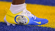 Custom cleats, to support Charms of Life, worn by Los Angeles Rams safety Kamren Kinchens, during the NFL's My Cause My Cleats weekend.