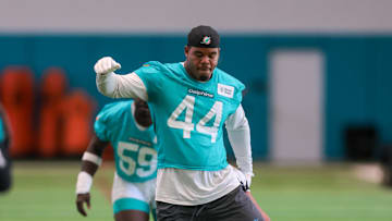 Jun 10, 2025; Miami, FL, USA; Miami Dolphins linebacker Chop Robinson (44) stretches during mandatory minicamp at Hard Rock Stadium. Mandatory Credit: Sam Navarro-Imagn Images
